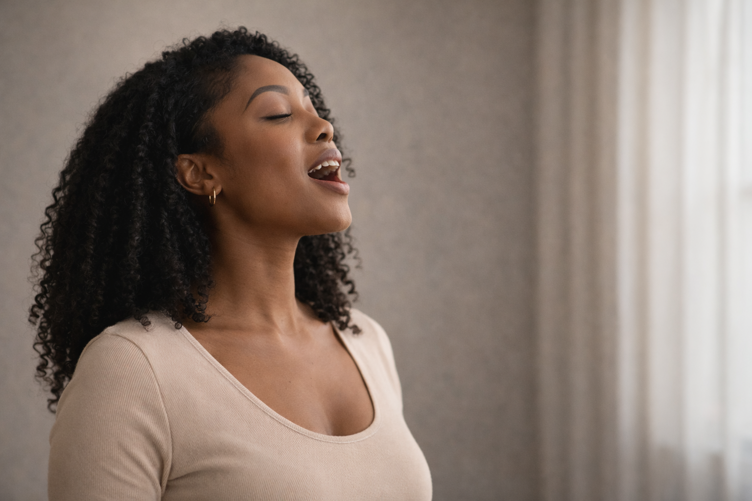 Singer demonstrating forward vocal placement with open resonant tone and relaxed vocal production